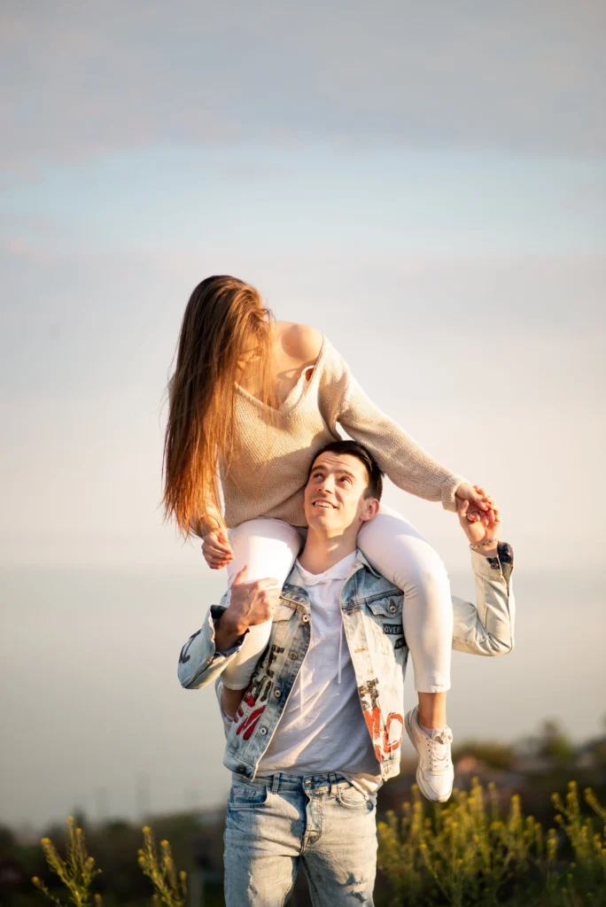 a joyful couple playing together in a natural setting, ideal for travel