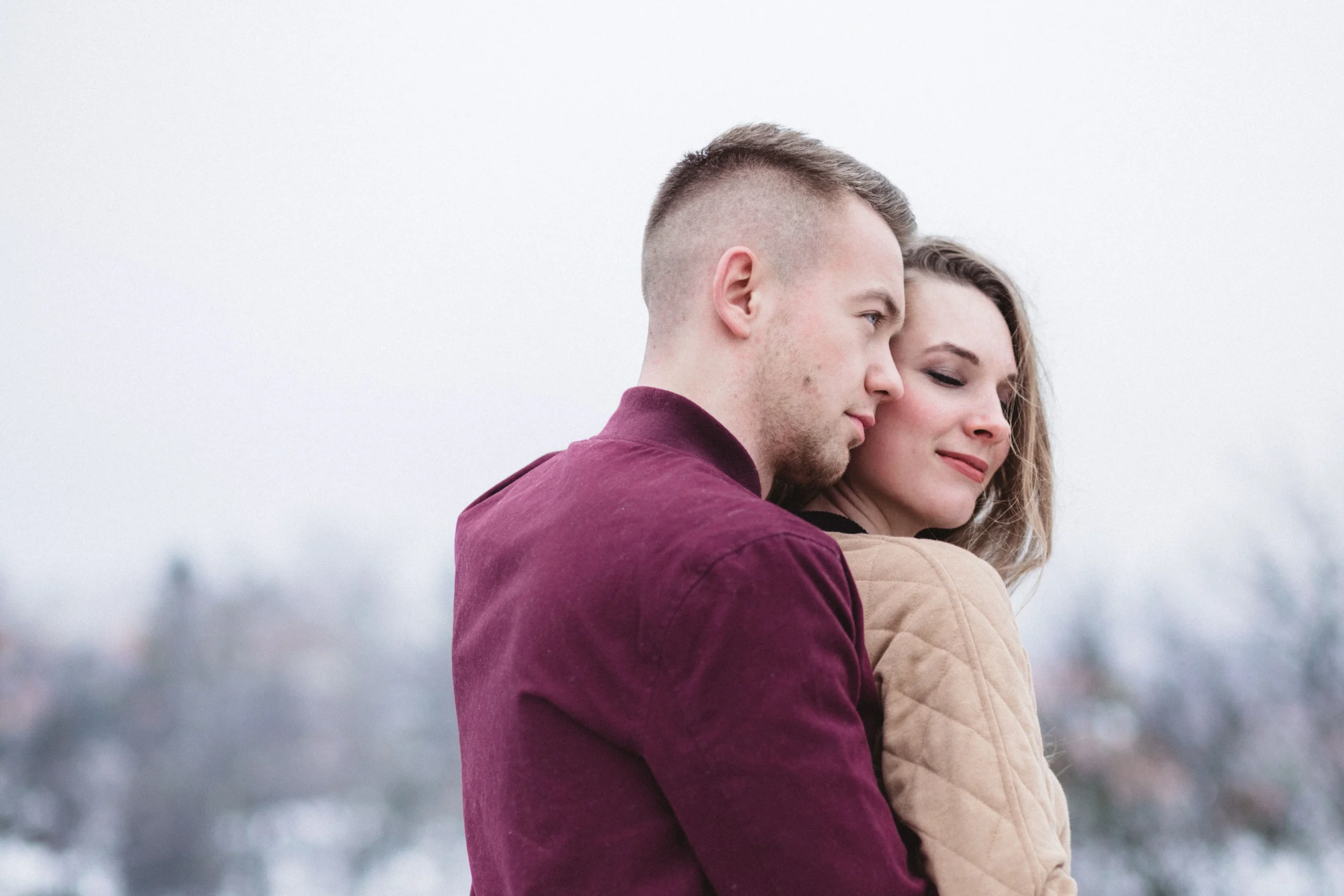 man embracing a woman